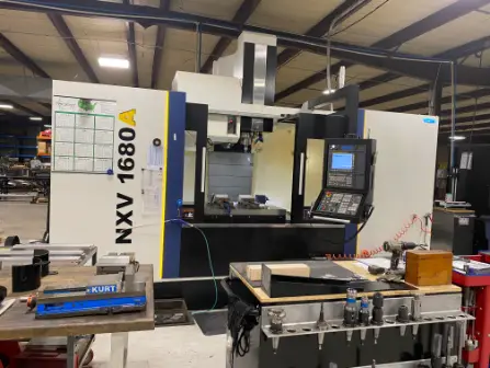 NKV 1680A CNC Machine in shop with tools and benches